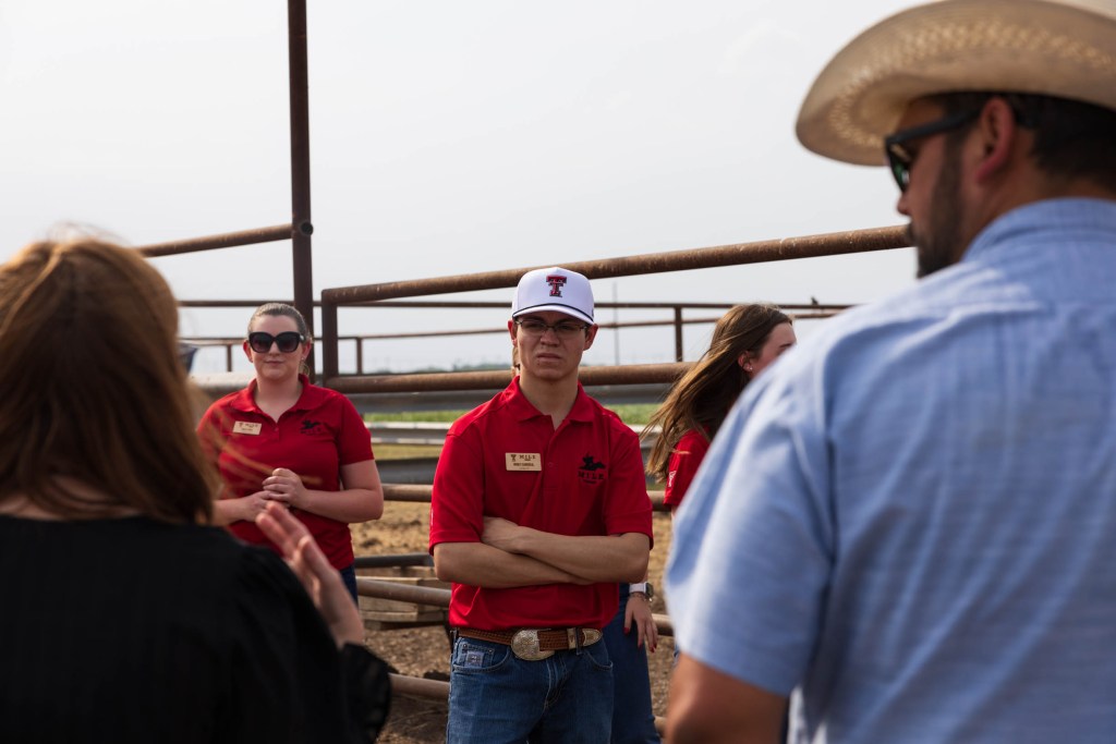 Students and instructors engaged in discussions during a tour of an agricultural facility in the Rio Grande Valley, Texas, showcasing leadership development in the agriculture industry.